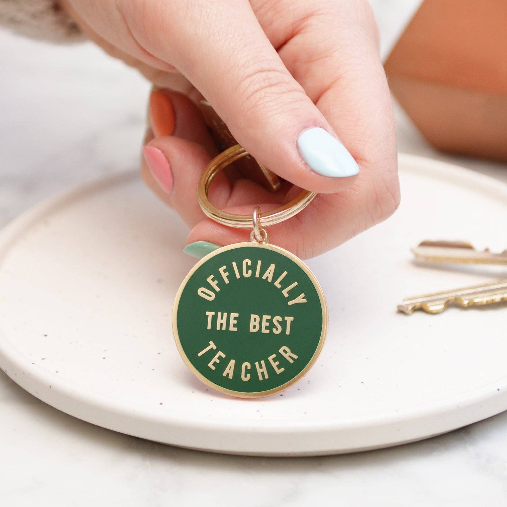 Alphabet Bags Officially the Best Teacher - Enamel Keyring